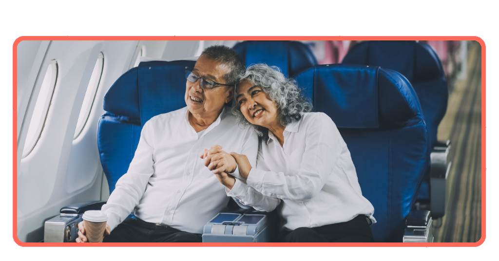Senior couple on a plane enjoying their trip with senior travel discounts